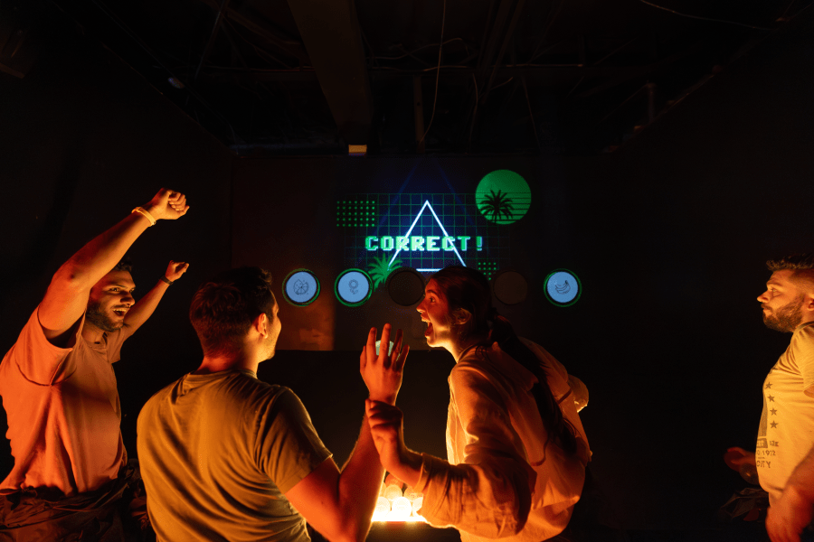 Masked people in a laser room