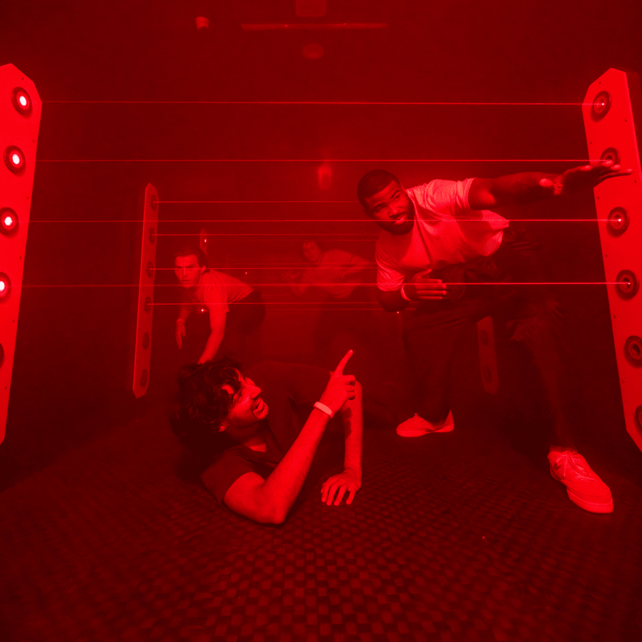 People trying to cross the room hidding from the lasers.